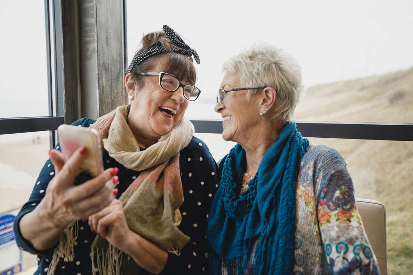 Two older women enjoying each other's company