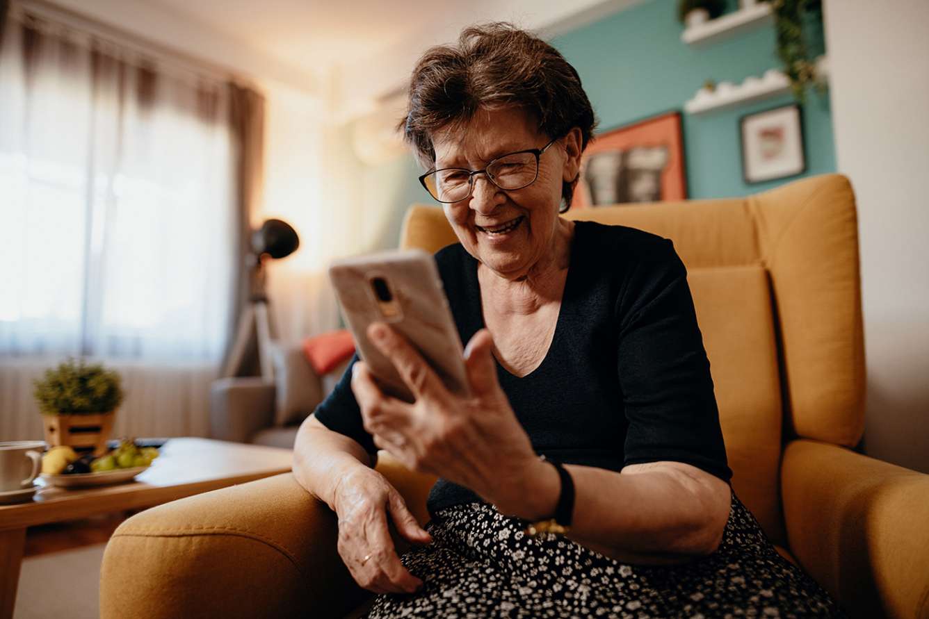 Older woman looking at phone