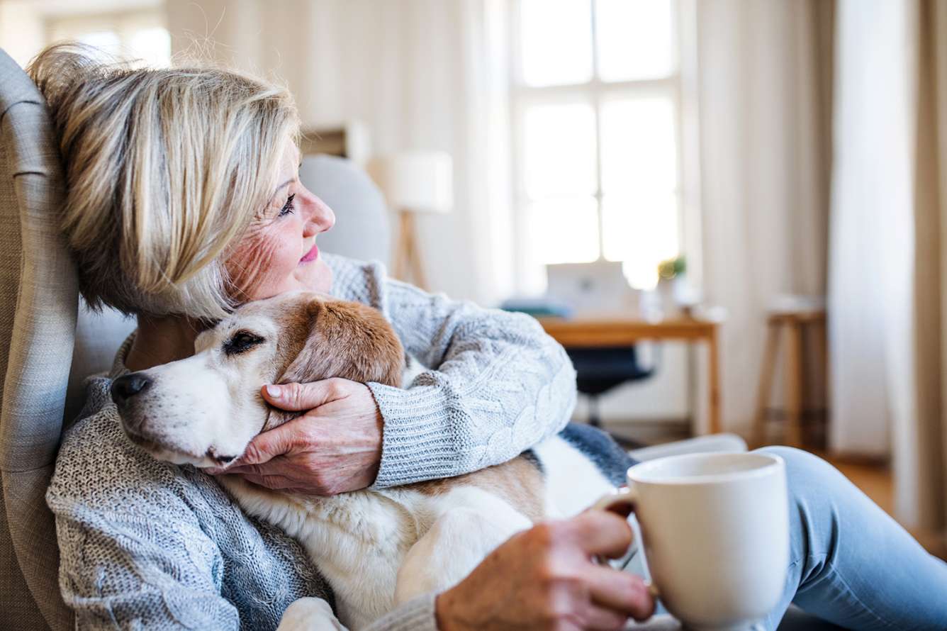 Woman at home with dog