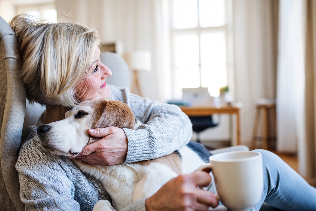 Woman at home with dog