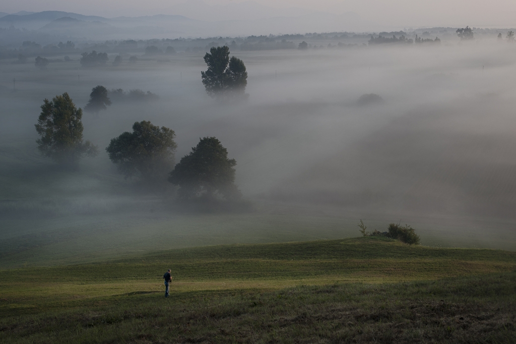 Woman sitting beside a window