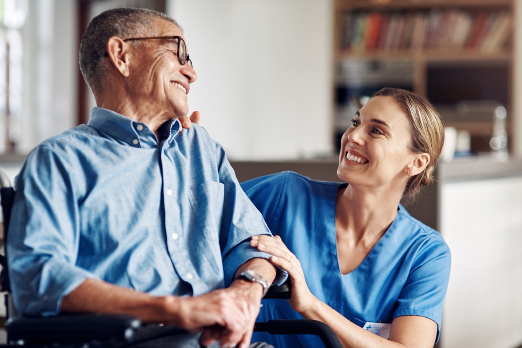 Nurse caring for elderly man
